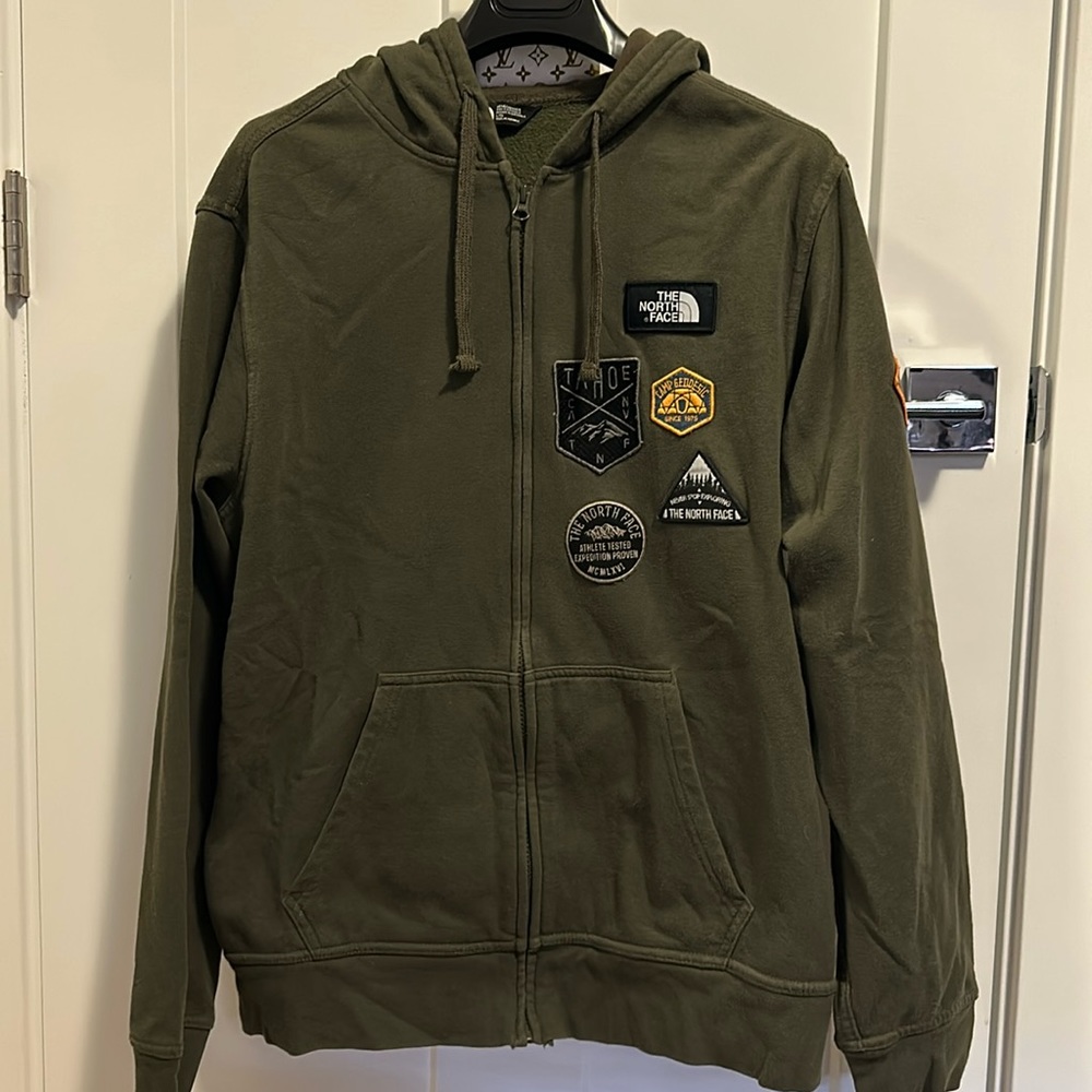 The NorthFace Jacket with logos on the front and back